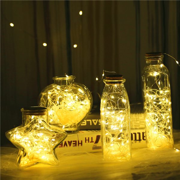 Glass bottle with gypsophila lights